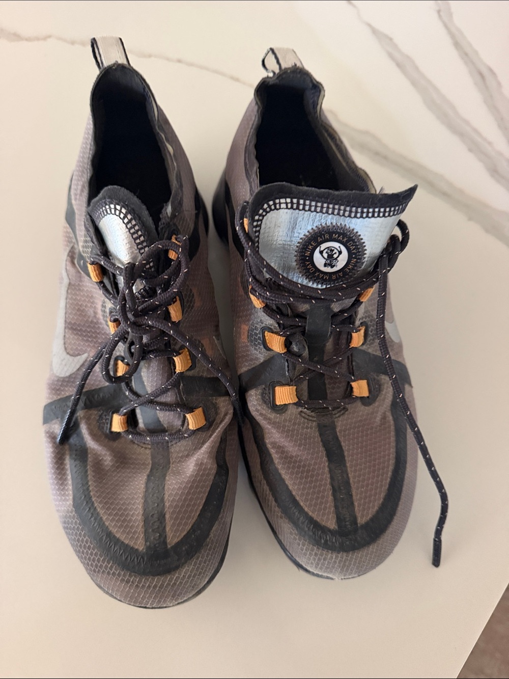 Nike Men’s Gray and Black Athletic Trainers with Orange Accents